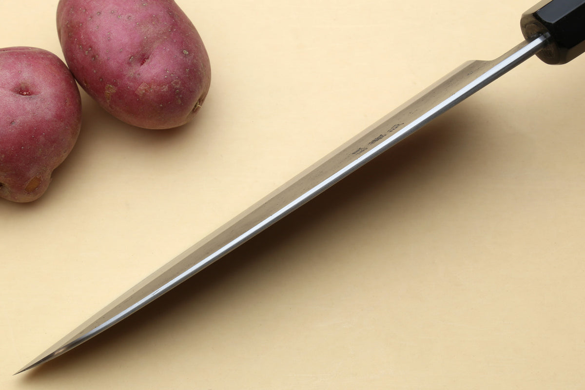 Japanese gyuto chef’s knife with long stainless blade and black handle
