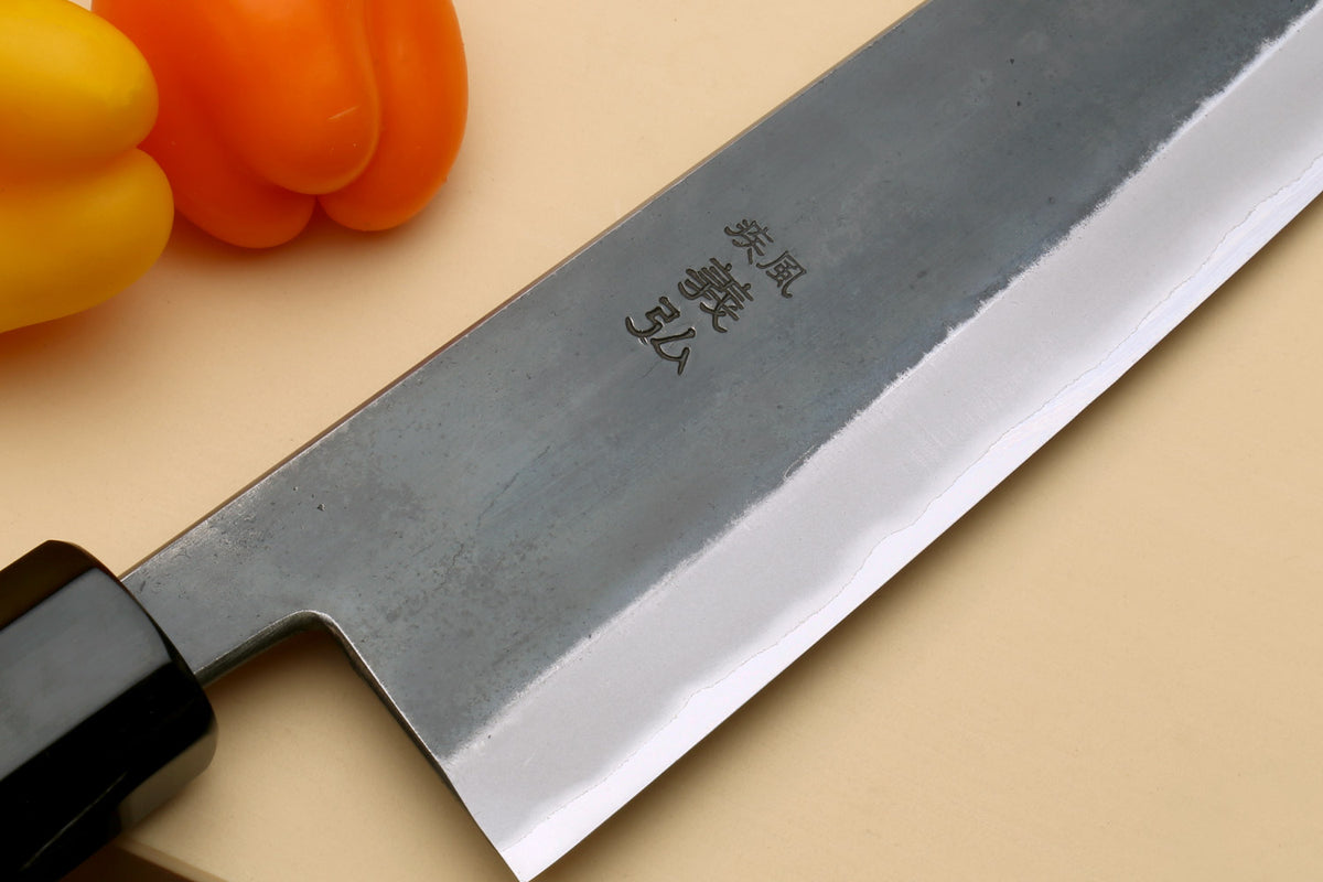 Stainless clad gyuto blade with markings and polished edge, Kaede wood handle
