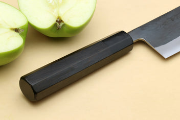 Nakiri vegetable knife with black ebony handle and tapered blue-steel blade