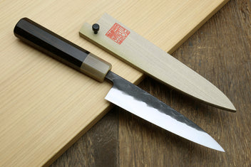Knife set on cutting board: long chef knife and shorter blade with dark wood handles