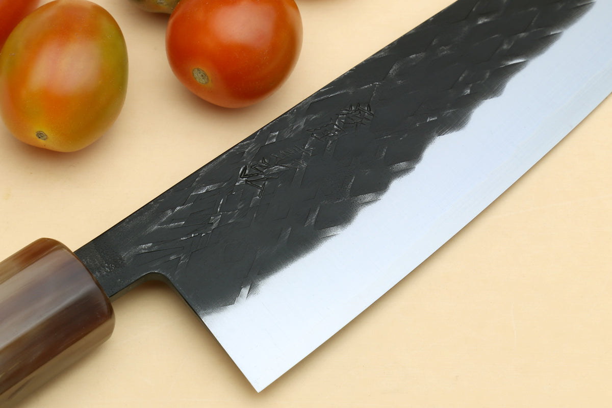 Damascus-style santoku blade close-up with stainless edge