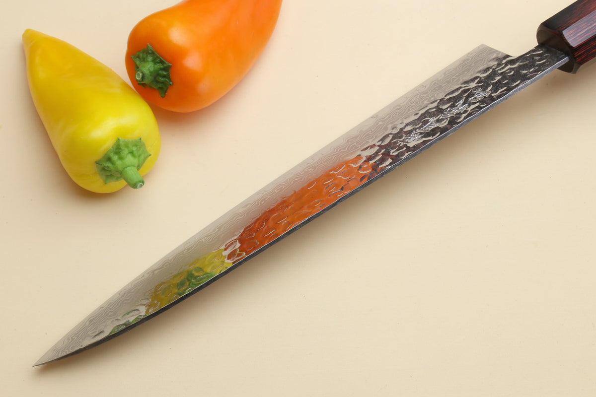 Chef's knife with hammered Damascus blade and dark octagonal rosewood handle