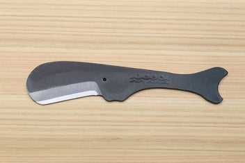 Utility knife side view with silver blade and dark kurouchi whale-shaped handle