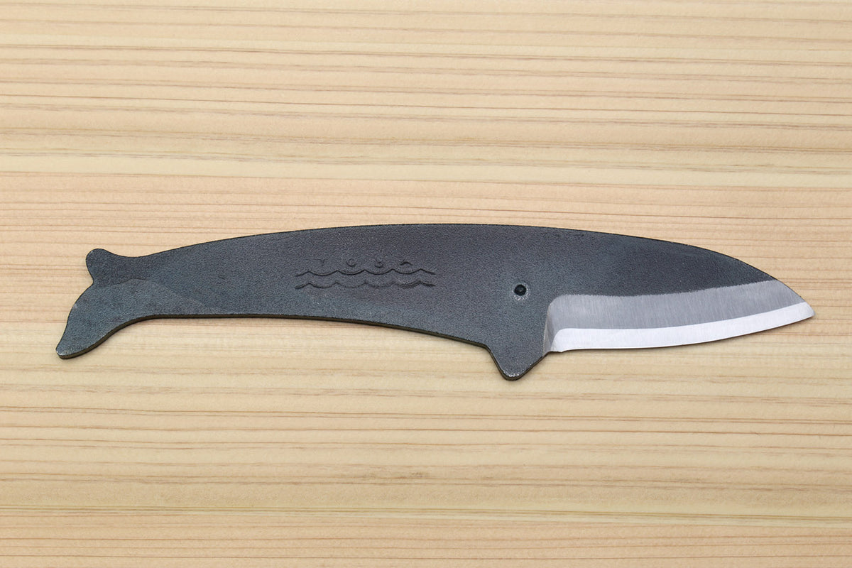 Whale utility knife with dark blue handle, silver blade edge, fish wave emblem