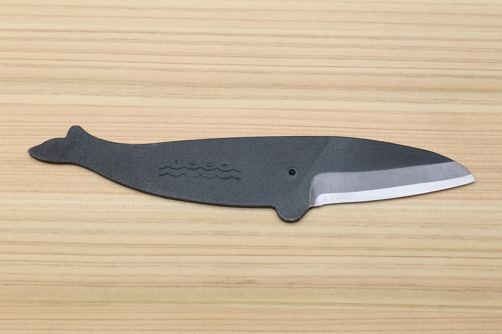 Utility knife with dark kurouchi finish, whale pattern, and tapered silver blade