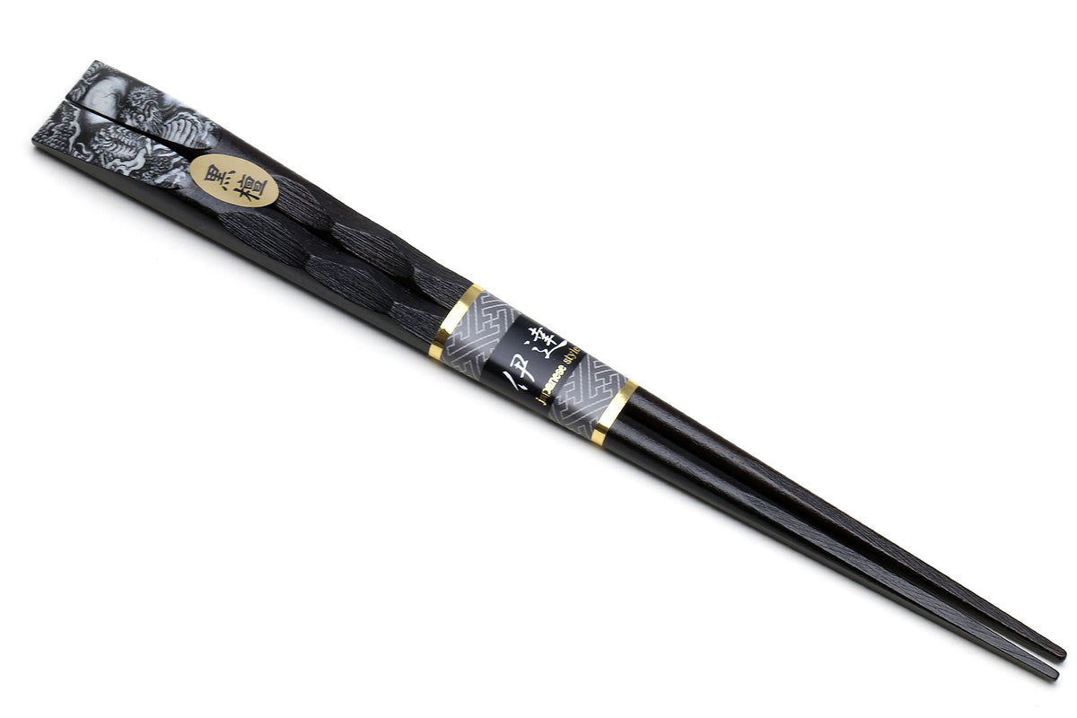 Japanese black chopsticks with dragon motif near tips