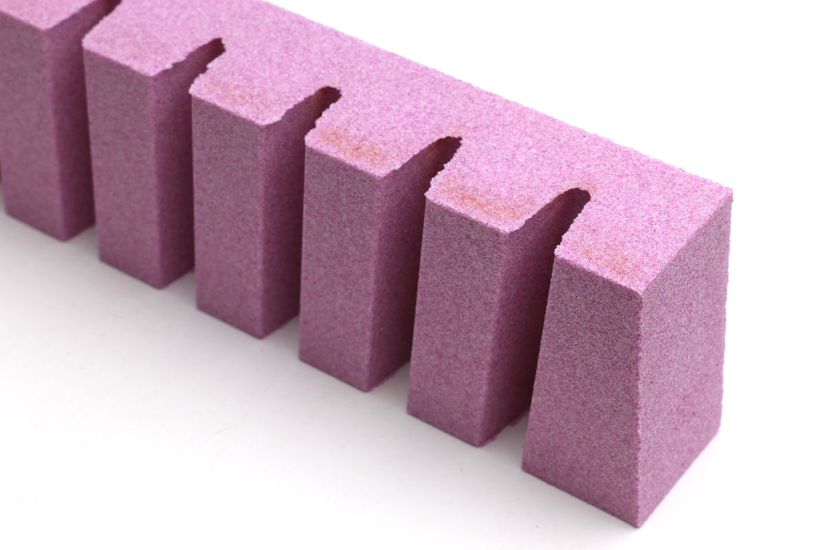 Purple conditioning stone blocks with U-shaped finger notches