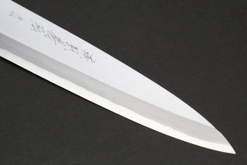 Japanese chef knife blade close-up with polished steel edge