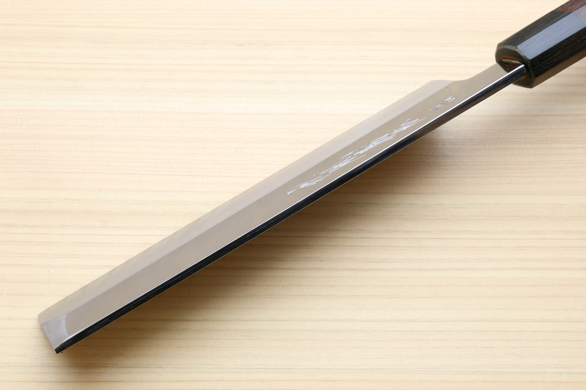 Japanese vegetable knife side view with pale steel blade and dark rosewood handle