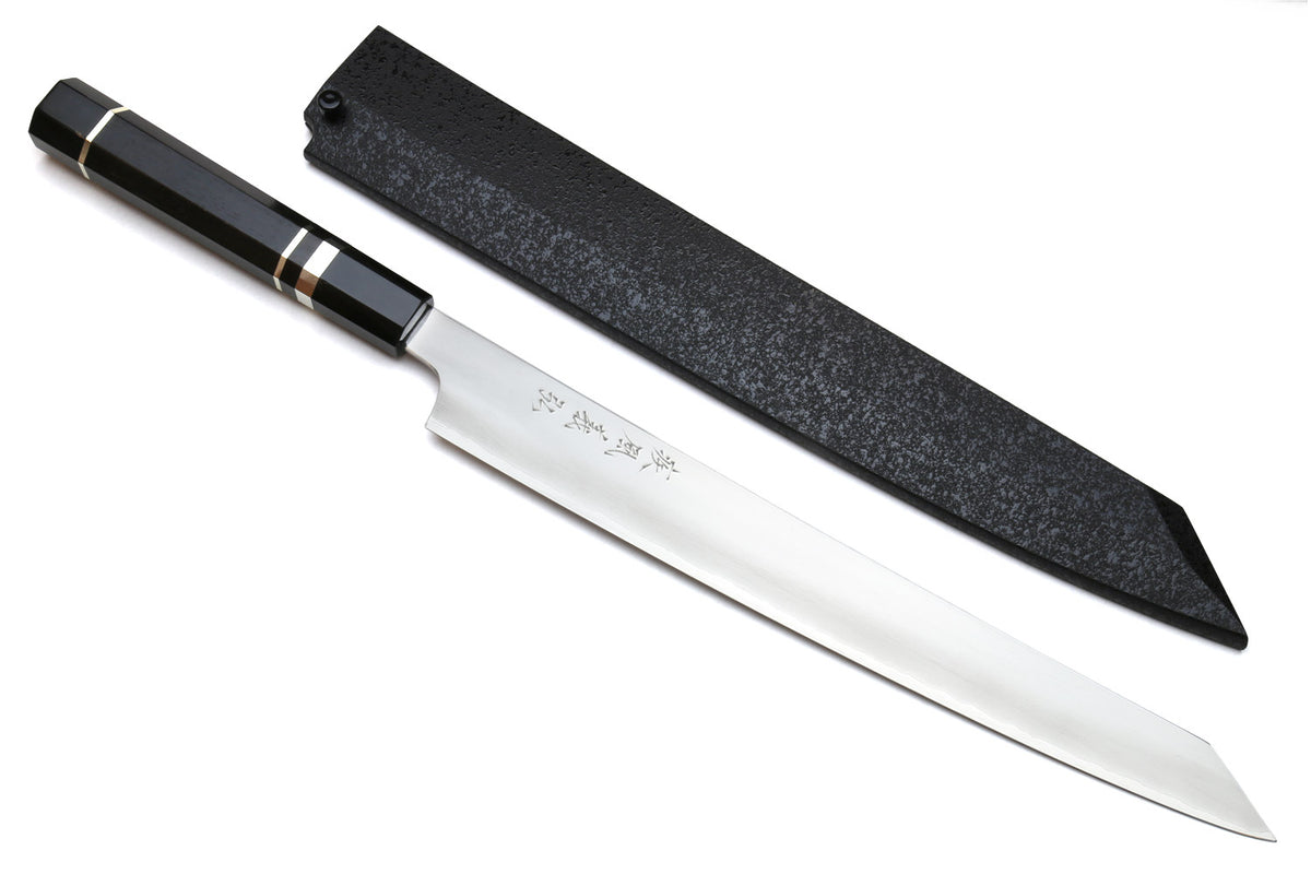 Kiritsuke slicer knife with white blade, dark ebony handle, and black sheath