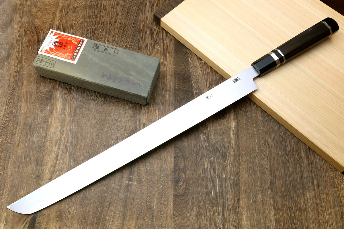 Tuna knife with long white steel blade, ebony handle with silver ring accents