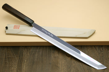 Japanese slicing knife with mirror-polished steel blade and ebony handle on sheath