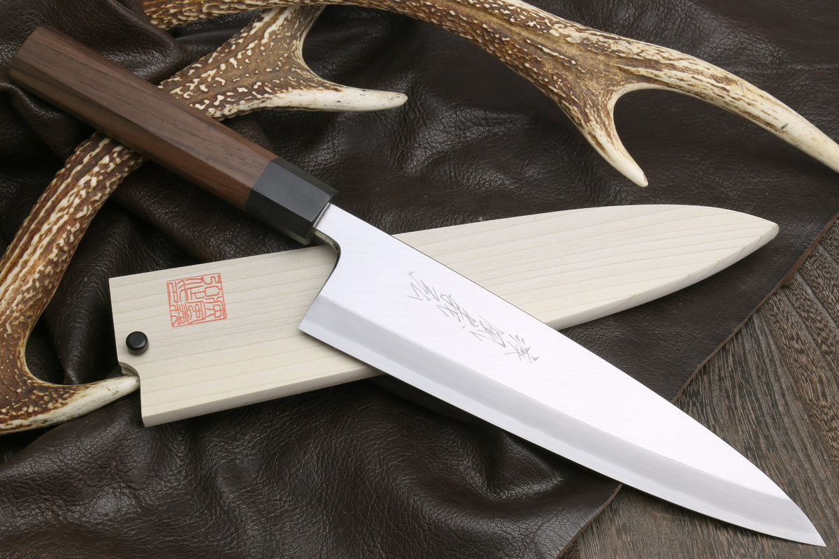 Japanese filet knife with pale blade and antler-style handle, single edge