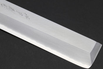Japanese chef knife blade edge close-up with pale polished finish