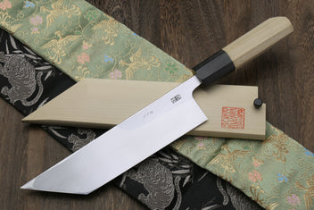 Eel filet knife with sheath and long blade on dark and green patterned fabric