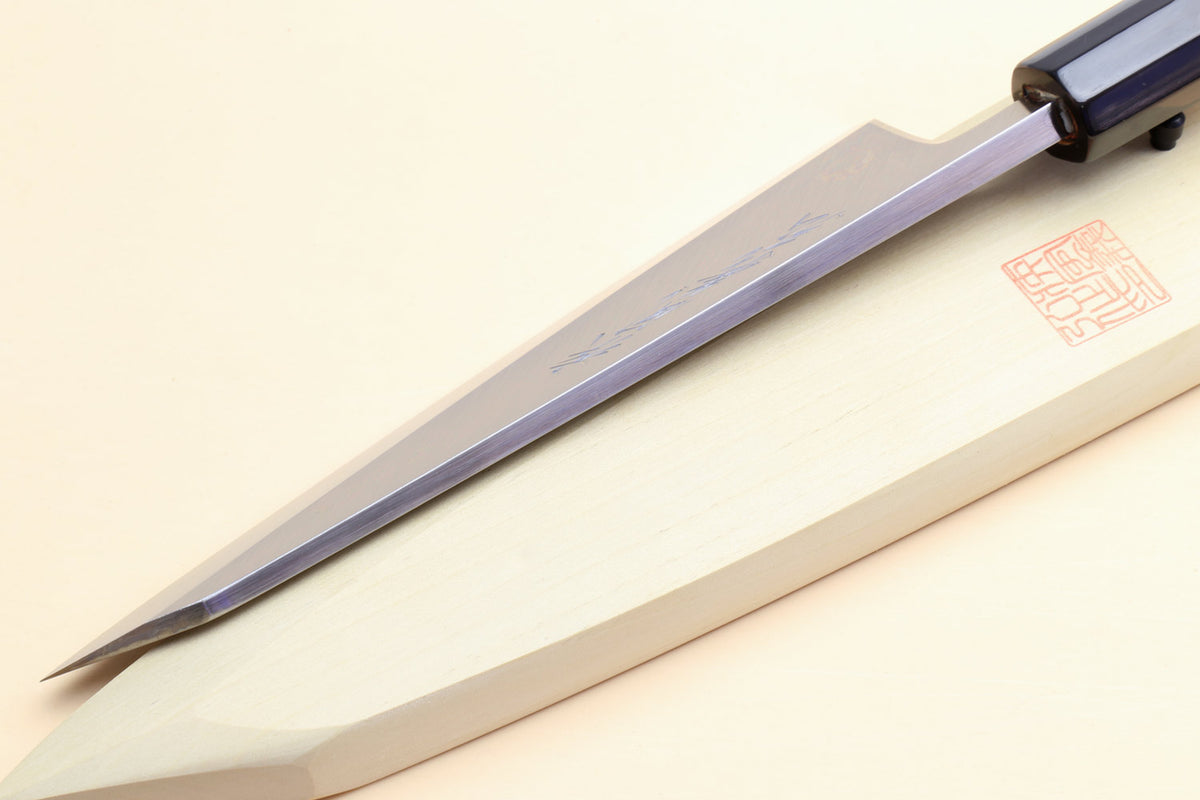 Japanese boning knife side view, pale handle, black collar, polished steel blade edge