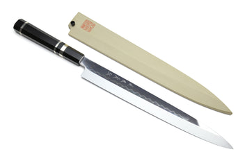 Japanese yanagiba sushi knife with mirror-finished blade and light blade cover; black handle with silver bands