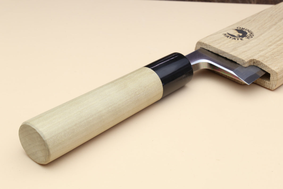Deba knife angled view: white blade, magnolia handle, black grip collar and pin