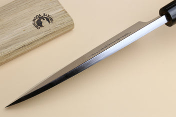 Deba knife shown side view: tapered white steel blade with dark rosewood handle