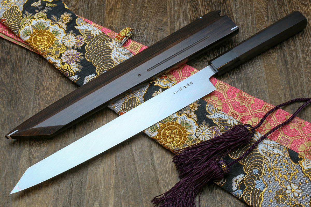 Japanese sushi knife with long mirror-finished white steel blade in black saya