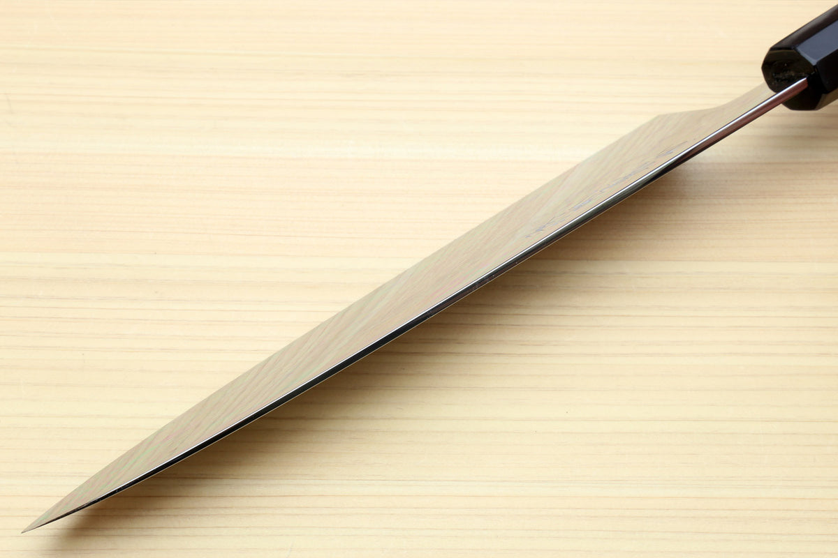 Japanese chef knife with long mirror-polished blade and dark handle