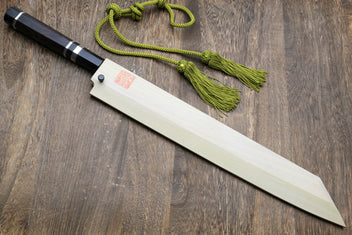 Japanese kitchen knife with dark handle, mirror-finished blade, and green cords
