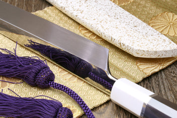 Japanese sushi sashimi knife with mirror-finished blade and white saya, purple cord tassel