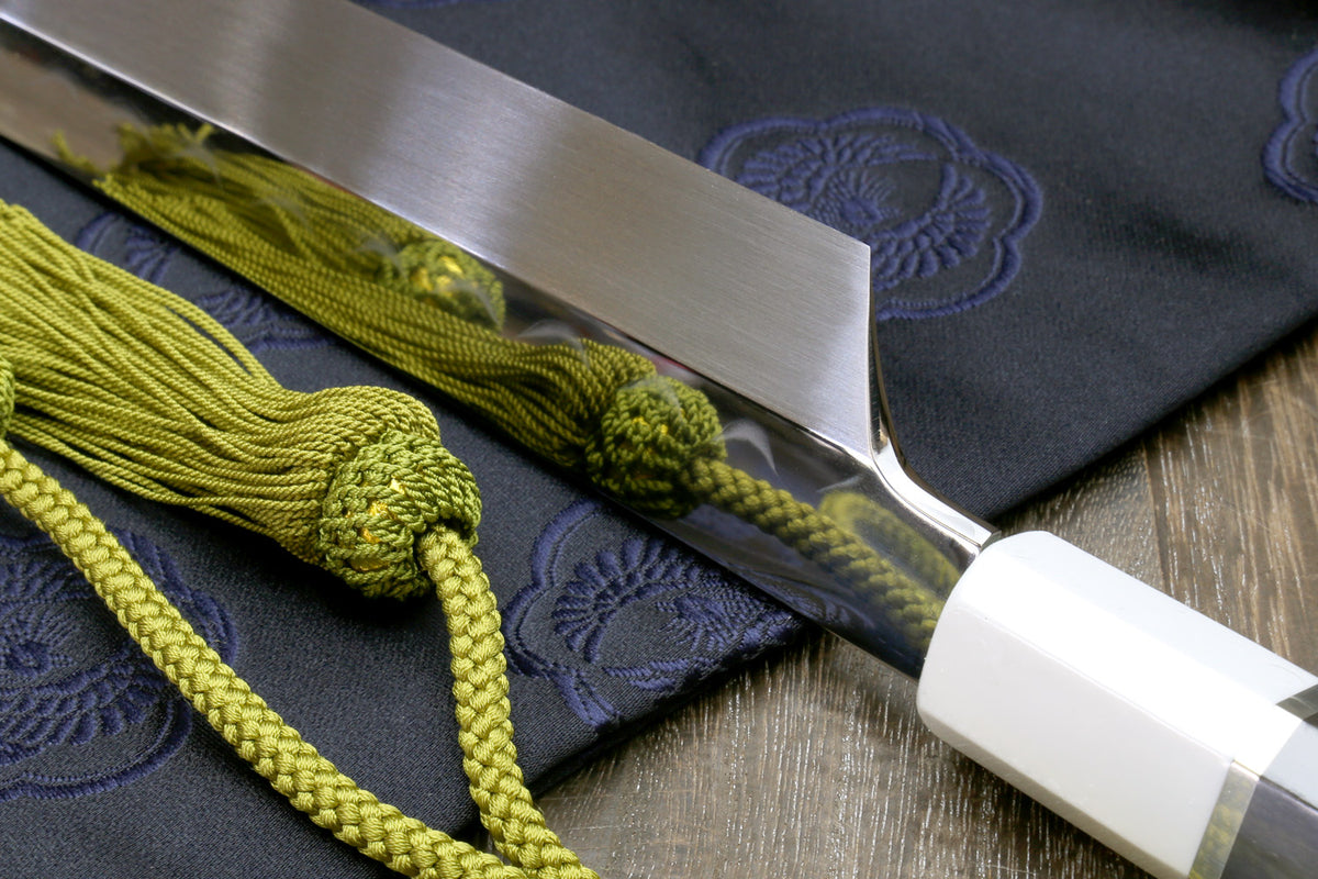 Mirror-finished Japanese sushi knife with white steel blade and dark Corian handle