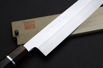 Kiritsuke knife with mirror-finished steel blade and dark wood handle with silver ring