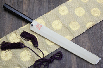 Japanese sushi knife with polished silver blade and dark handle