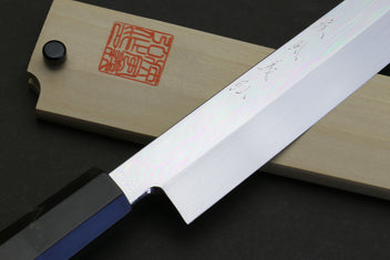 Sakimaru sushi knife with polished blade and dark handle, side angle view