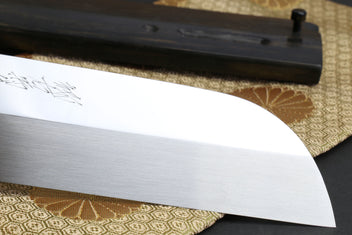 Mirror-finished white steel blade curve with dark ebony handle section