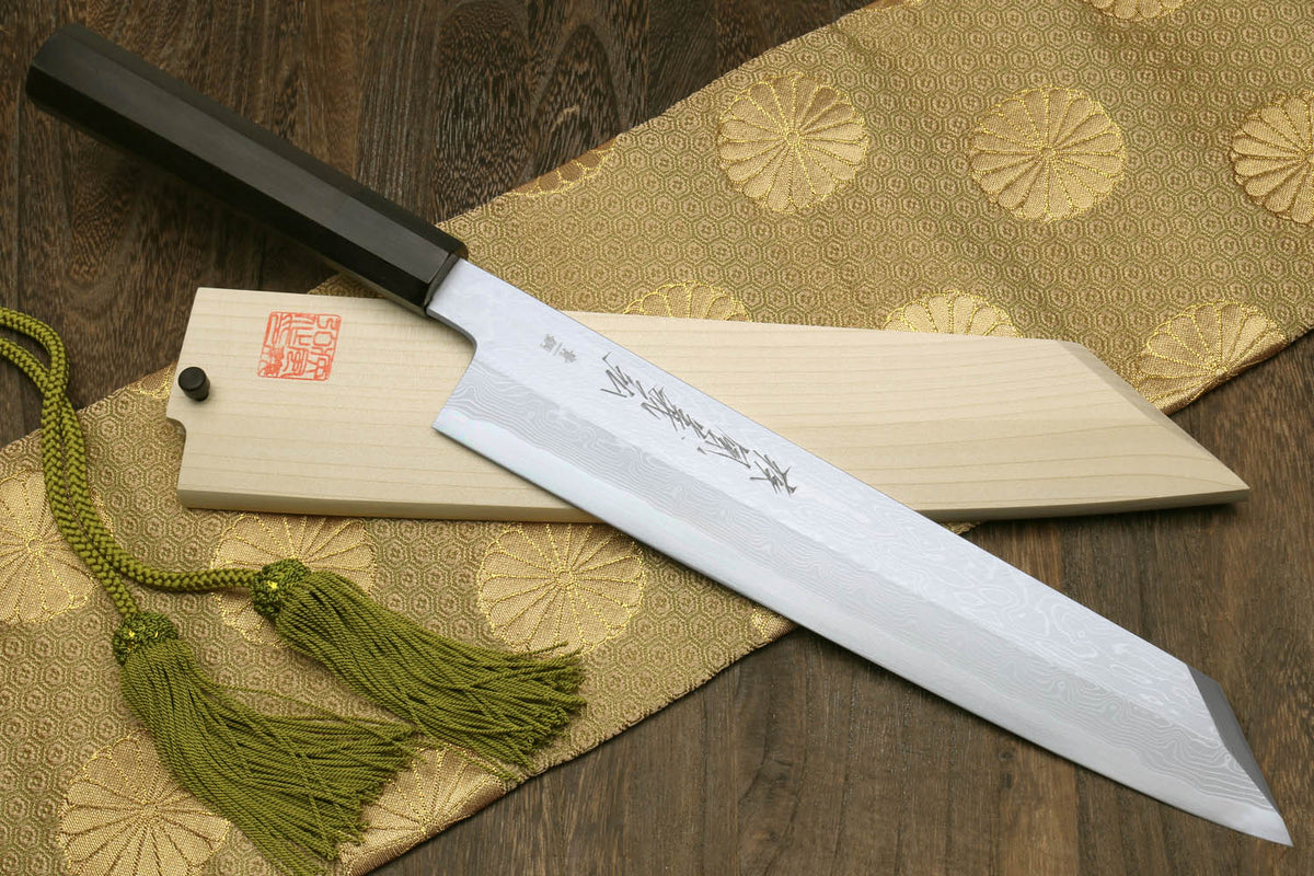 Japanese chef knife with ebony wood handle, white blade with subtle etching