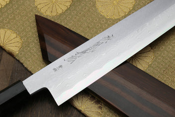 Damascus Kiritsuke chef knife blade with etched pattern and ebony handle