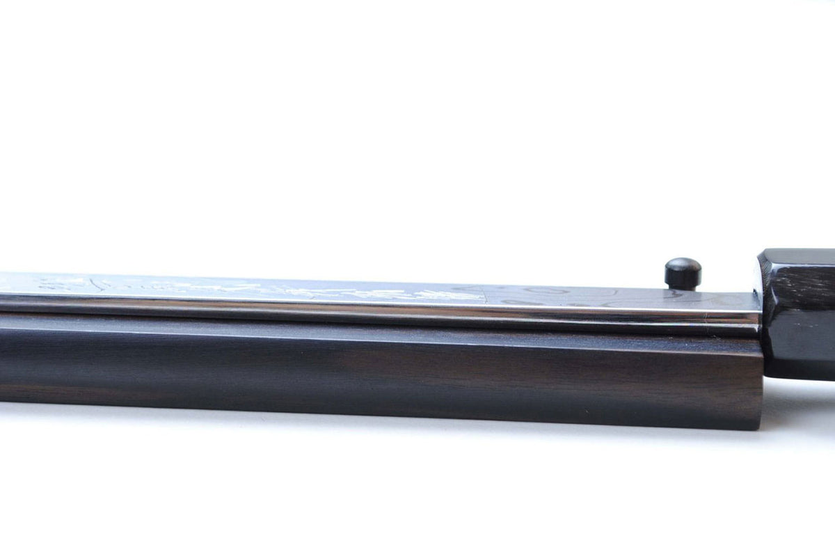 Suminagashi Japanese chef knife with dark ebony wood handle, steel tang close-up