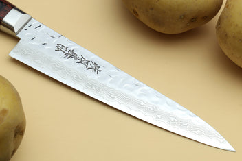 Damascus stainless knife blade with hammered pattern and etched characters