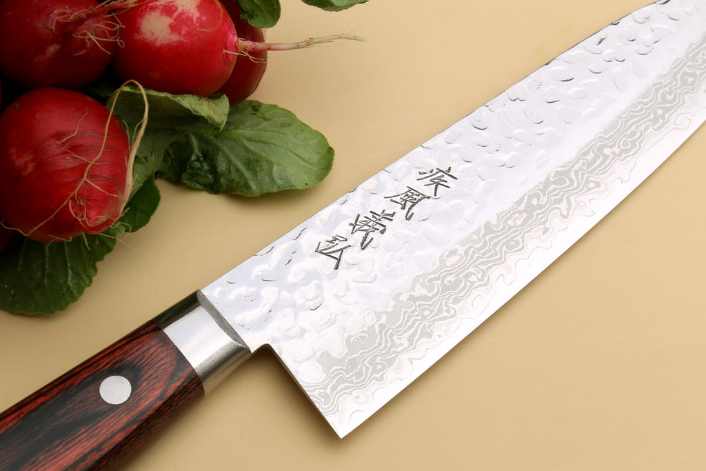 Damascus-pattern knife with dark wood handle and silver bolster