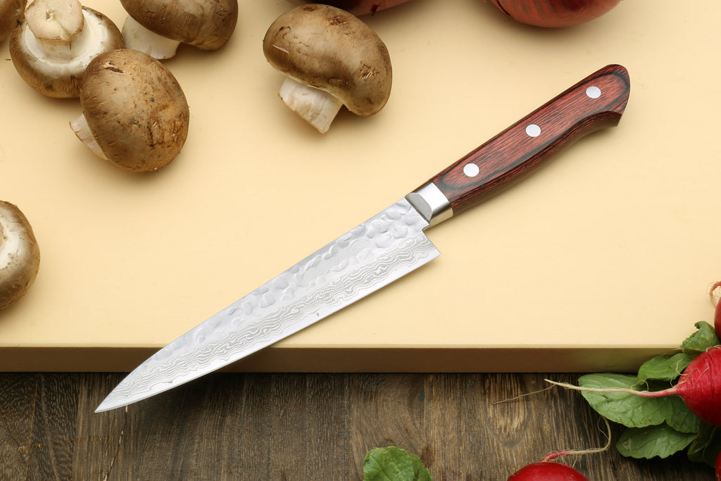 Damascus-pattern shorter knife with dark wood handle and silver bolster